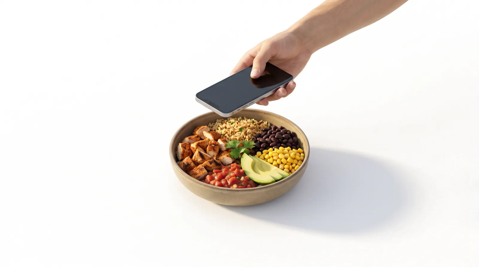 A hand holding a phone above a burrito bowl to take a photo